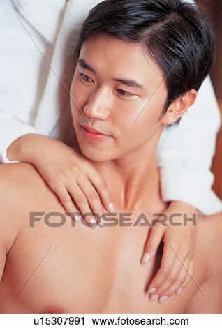 Stock Image - bare chest, bathrobe, asian ethnicity. Fotosearch