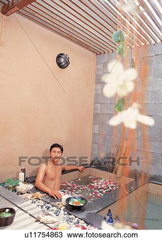Stock Image - bare chest, bathtub, beautification. Fotosearch