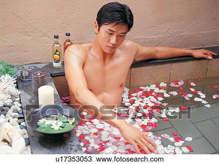 Stock Image - floating, tied, process, indoor, rose petals. Fotosearch