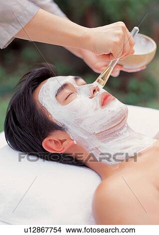 Picture - Man getting a facial . Fotosearch