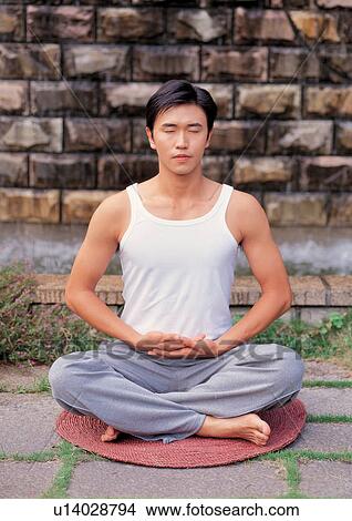 Picture - Man meditating . Fotosearch