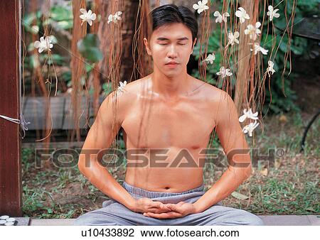 Stock Image - Man meditating . Fotosearch