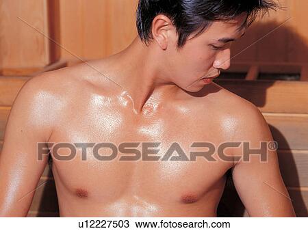 Stock Image - sauna, asian ethnicity, comforting, short hair, young adult, bench, therapy. Fotosearch