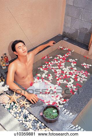 Stock Image - sitting, glancing, preparation, beautifying, bathtub, happy, happiness. Fotosearch