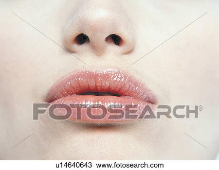 Stock Image - Extreme Close-Up, Human Mouth, Beauty Treatment, Full Frame, Beauty Spa, Pampering, Young Adult. Fotosearch