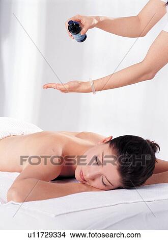 Picture - Massage Therapist, Massage Table, Part Of, Comfortable, Bodycare, Semi-Dress. Fotosearch
