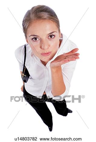 Stock Image - blonde hair, business executive, pursing, young adult, occupation, one person, flying kiss. Fotosearch