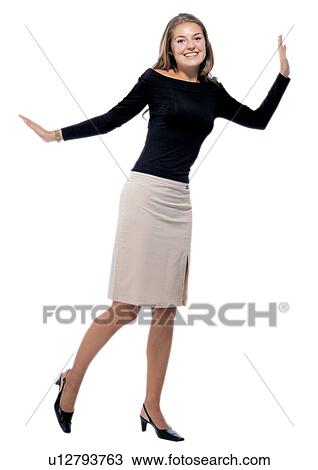 looking at camera, standing, gesturing, smiling, lifestyle, well-dressed View Large Photo Image Stock Image - looking at camera, standing, gesturing, smiling, lifestyle, well-dressed. Fotosearch