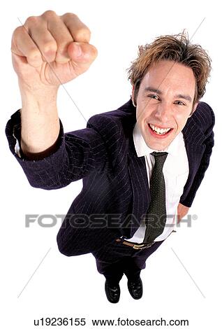 Stock Photography - success, business executive, indoor, gesturing, standing, smiling, celebration. Fotosearch