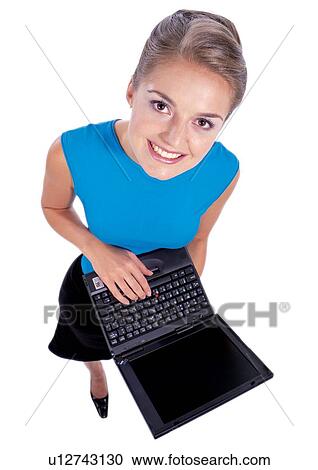 Stock Image - turquoise blue, indoor, occupation, looking at camera, profession, career. Fotosearch