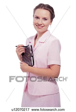 Stock Photo - waist-up, pink dress, half length, smiling, well-dressed. Fotosearch