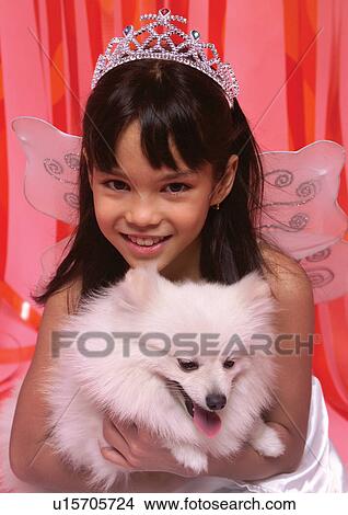 Picture - one person, girl, care, holding, looking at camera, together. Fotosearch