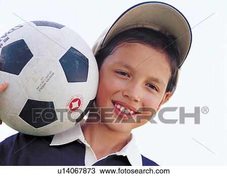 Stock Image - ball, cap, boy, 6-7 years. Fotosearch