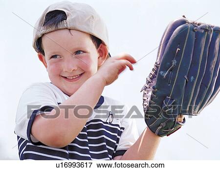 Stock Photo - baseball, baseball gloves, baseball cap, 6-7 years. Fotosearch