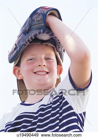 Stock Photo - baseball, baseball gloves, baseball cap, 6-7 years. Fotosearch