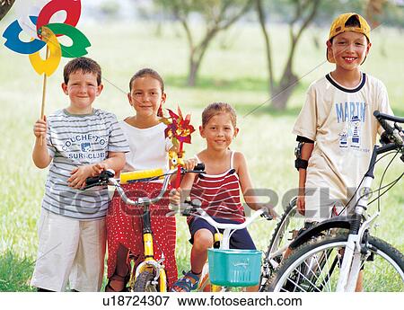 Stock Photo - bicycle, boys, blurred, 6-7 years. Fotosearch
