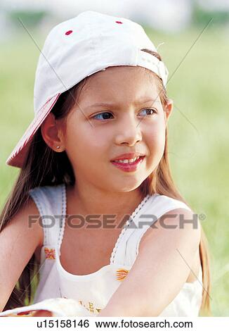 Stock Photograph - blur, carefree, cap, 6-7 years. Fotosearch