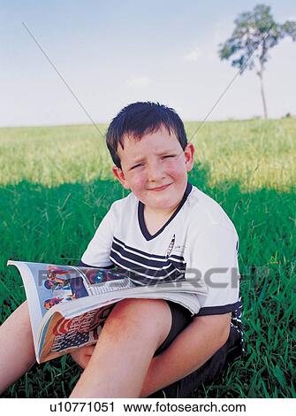 Stock Image - book, carefree, boy, 6-7 years. Fotosearch