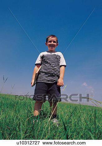 Stock Photo - book, carefree, boy, 6-7 years. Fotosearch