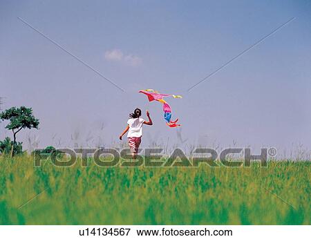 Stock Photo - flying, kite, casual, carefree. Fotosearch