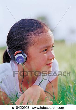 Stock Photo - headphones, head and shoulders, listening. Fotosearch