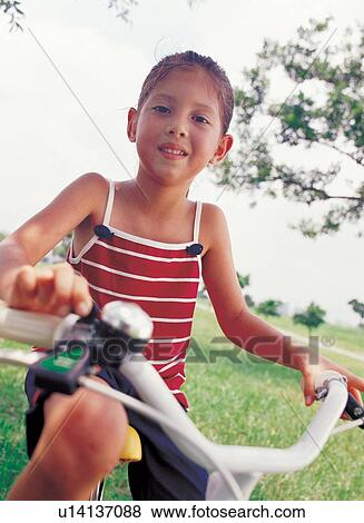 Stock Photo - holding, individual, grass, day, portrait, childhood. Fotosearch