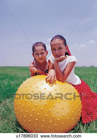 Stock Image - toothy smile, friends, individual, happy, emotion, childhood. Fotosearch