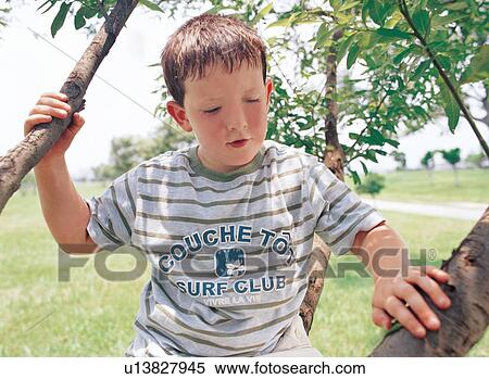 youth, kid, looking down, sitting, minor View Large Photo Image Stock Photography - youth, kid, looking down, sitting, minor. Fotosearch