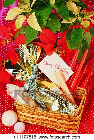 Stock Photo - candle, poinsettia, decoration, holiday, Christmas, colorful. Fotosearch