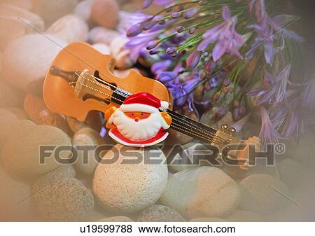 Stock Photo - santa claus, holiday, tree, Christmas, decoration, violin. Fotosearch