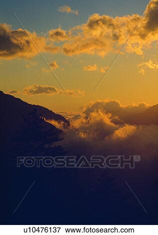 cloud, light, scenery, sunset, daytime, mountain View Large Photo Image Stock Photo - cloud, light, scenery, sunset, daytime, mountain. Fotosearch