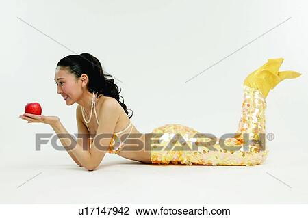Stock Image - Apple, Cheerful, Black Hair, Asian Ethnicity, 18-19 Years. Fotosearch
