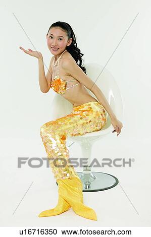 Stock Image - Asian Ethnicity, Cheerful, Chair, Black Hair, 18-19 Years. Fotosearch