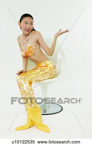 Stock Photography - Asian Ethnicity, Costume, Chair, Black Hair, 18-19 Years. Fotosearch