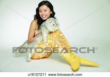 Stock Image - Bizarre, Looking At Camera, Mermaid, Cat, Fantasy, Creative People, Toothy Smile. Fotosearch