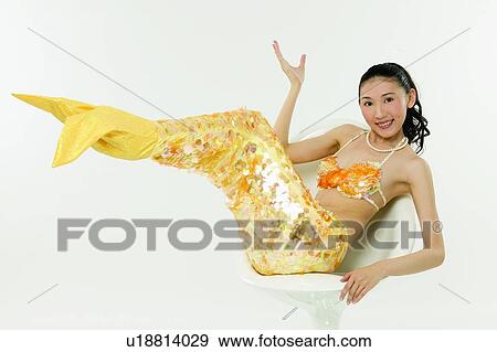 Stock Photo - Bizarre, Sitting, Gesturing, One Person, Mermaid, 18-19 Years. Fotosearch