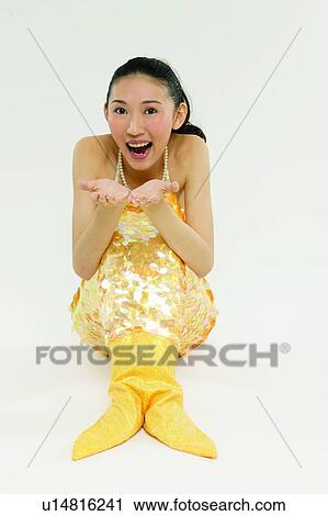 Stock Image - Black Hair, Glamour, Laughing, 18-19 Years, Excitement, Long Hair, Sitting. Fotosearch