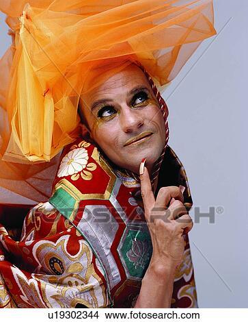 Colored Background, Bizarre, Looking Up, Headdress, One Person View Large Photo Image Picture - Colored Background, Bizarre, Looking Up, Headdress, One Person. Fotosearch