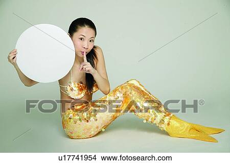 Picture - Costume, Toothy Smile, Happiness, Finger On Lips. Fotosearch