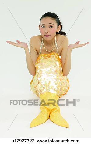 Stock Image - Gesturing, Mermaid, Surprise, Young Adult, Sitting, Black Hair. Fotosearch