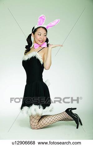 Stock Photo - Indoor, Confidence, Creative, One Young Woman Only, Smiling, Gesturing. Fotosearch