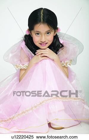 Stock Photography - One Child Only, Happiness, Hair Part, Angel, Hand On Knee, Creative, Child. Fotosearch