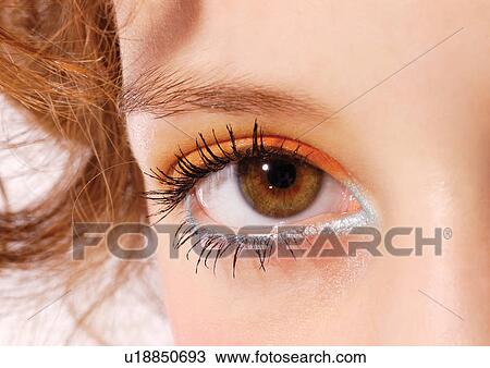 An eye with orange and teal eyeliner View Large Photo Image Stock Image - An eye with orange and teal eyeliner . Fotosearch