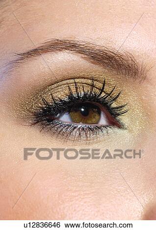 Stock Photograph - Evening make-up on a brown eye. Fotosearch