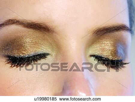 Eyes closed with evening gold make-up View Large Photo Image Stock Photography - Eyes closed with evening gold make-up. Fotosearch