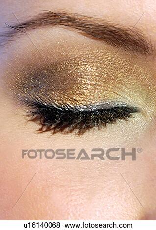 Gold eye make-up on a closed eye View Large Photo Image Stock Photo - Gold eye make-up on a closed eye. Fotosearch