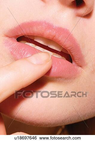 Stock Photograph - One Young Woman Only, Sensuality, Detail, Part Of, Human Face, Human Mouth. Fotosearch