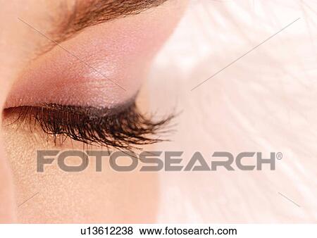 Up-close to an eye with pink eyeshadow View Large Photo Image Stock Photo - Up-close to an eye with pink eyeshadow . Fotosearch