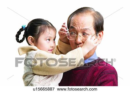Stock Photo - Adjusting, Black Hair, Balding, Asian Ethnicity, 6-7 Years. Fotosearch