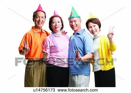 Stock Image - Asian Ethnicity, Cardigan, Brown Hair, Birthday Hat, Adults Only. Fotosearch